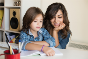 parent helping child read at home