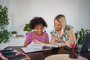 Tutor working with child